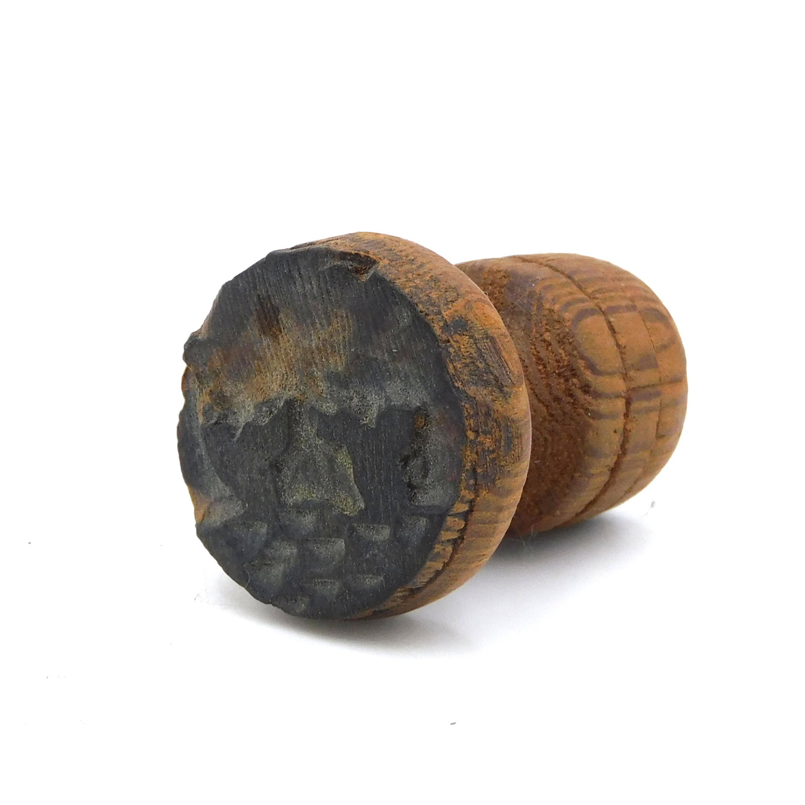 Whaling Logbook Stamp: 19th century. Hand carved with two whale flukes out of water. 1 1/2" high x 1 1/4" diameter. Age appropriate wear.