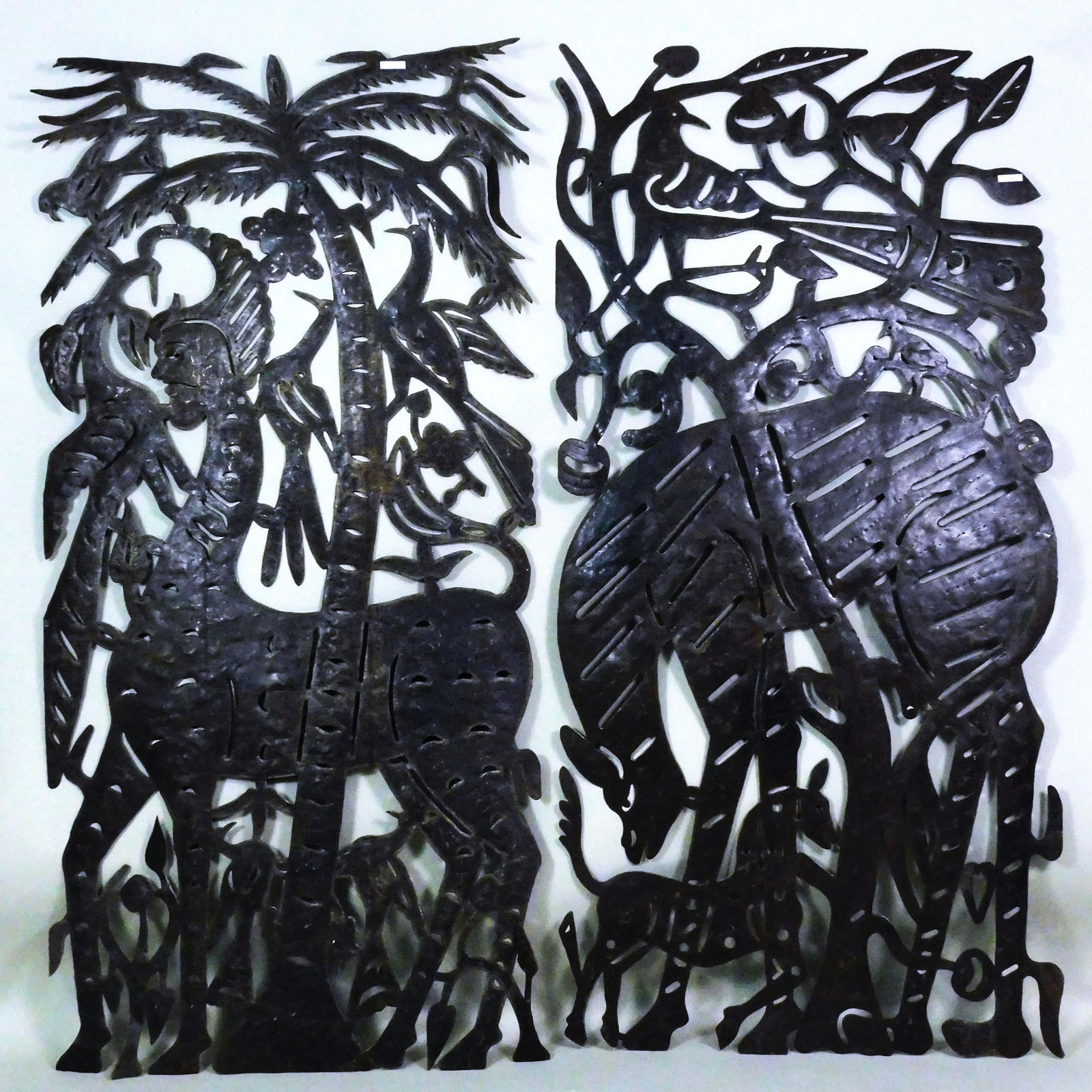 Jean Pierre Bernard for Harvey Probber: 1960s-70s. (2) torch-cut welded and chased flat panels, made in Croix-des-Bouquets, Haiti of recycled steel drums. Typical of Haitian folk art, these panels feature birds, foliage, and humanoid figure