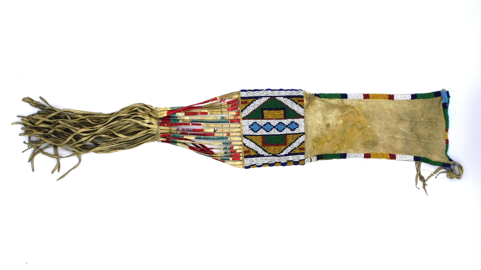 Central Plains, Possibly Sioux Tobacco Bag: Circa 1880-1890. Multi-colored beads, geometric design. Quill wrapped fringe. 5" wide x 27" overall long. Shows some quill loss.