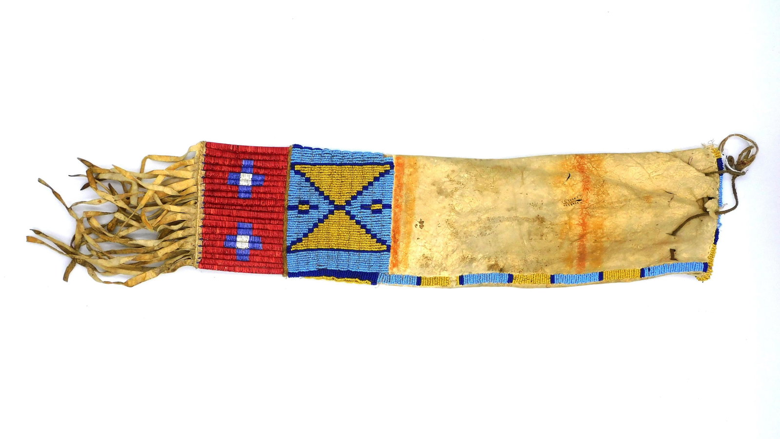 Plains Tobacco Bag: Circa 1880-1890. Blue and yellow beads, quill wrapped fringe with geometric designs. 4 1/2" wide x 24" long. Leather shows some separations and old stitching.