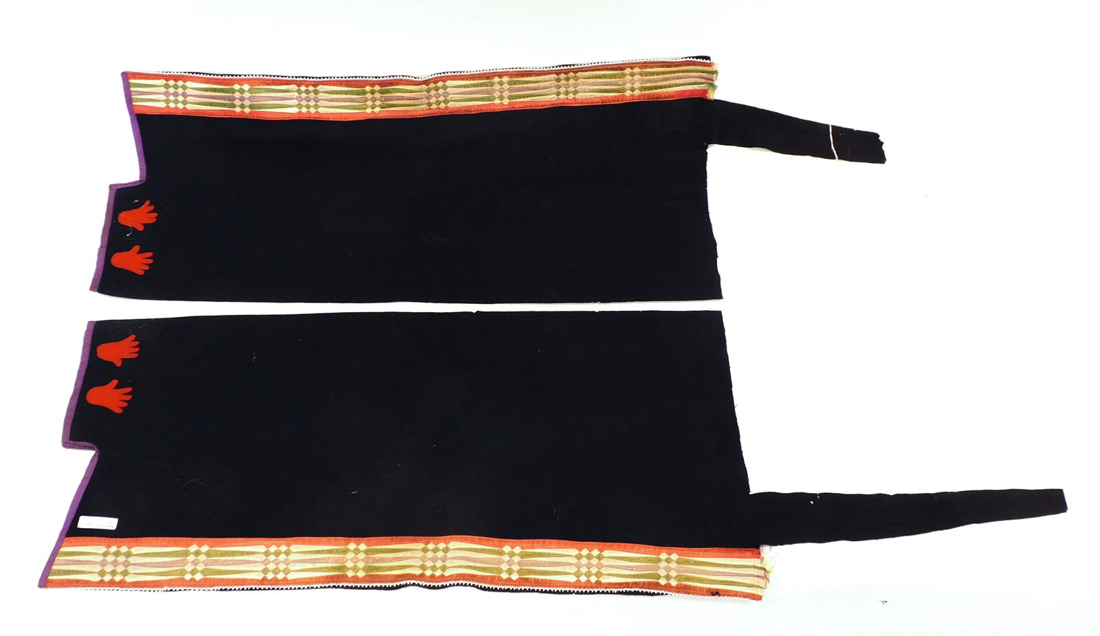 Osage Clothing: To include a pair of early 20th century men's legging and beaded sash with silk ribbon applique, together with an unfinished skirt with geometric silk ribbon borders. Leggings: 31 1/2" long. Show mino