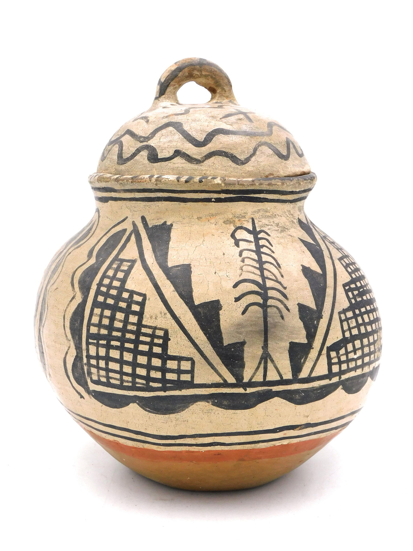 Tseque Pueblo Lidded Jar: Early 20th century. Geometric painted decoration, handled lid. 9" high x 6 1/4" diameter. Shows crack.