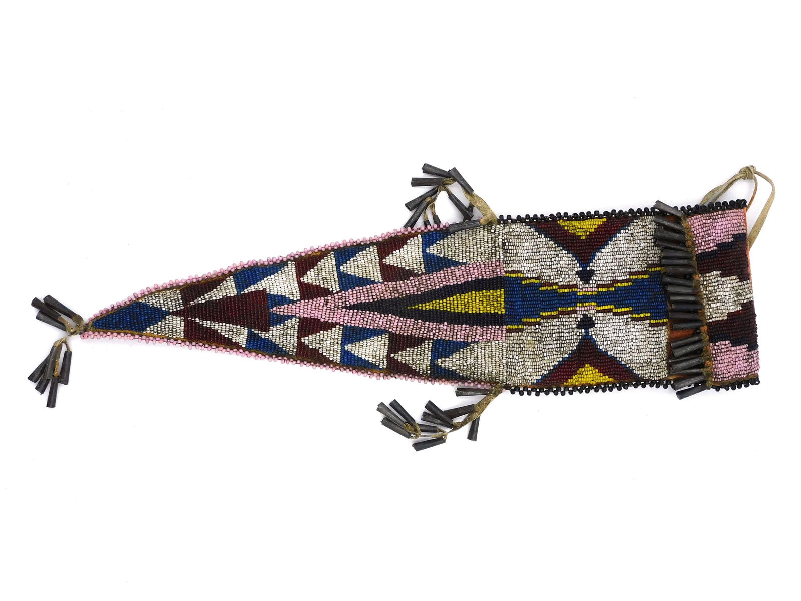 Beaded Plains Bag: 20th century. Geometric design, multi-colored. Tin conical decoration. 4" wide x 17" long overall. Good overall condition.