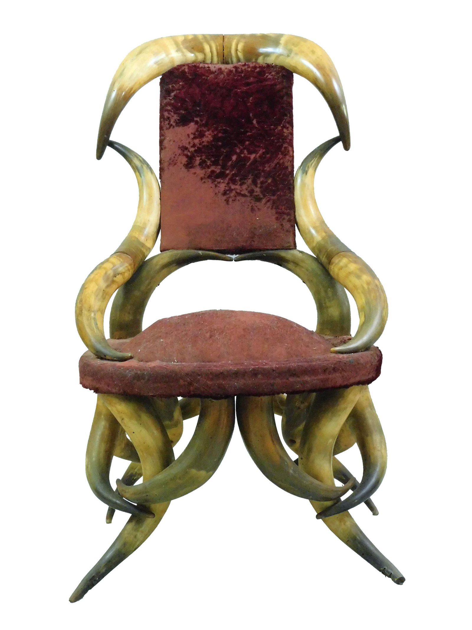 Victorian Horn Chair: 19th century. Made with approximately 20 steer horns. Worn velvet upholstered seat and back. 39 1/2" high x 22" wide x 21" deep; seat height 16 1/2". Overall good condition with age appropriate wear. 