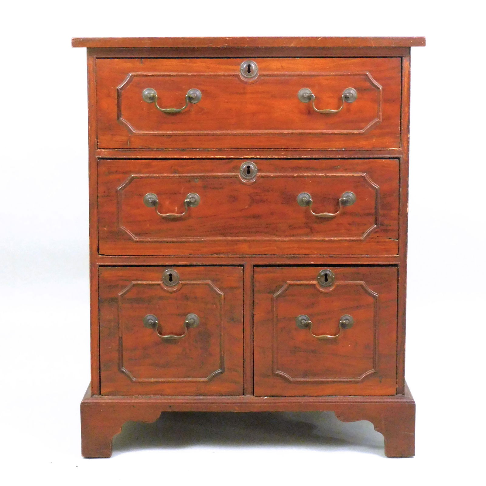 Anglo Indian Georgian Teak Chest: 19th century. Two rectangular drawers over two square drawers. It has a bracket base and brass hardware. 35 1/4" high x 25 1/2" wide x 23 3/4" deep. Old finish with surface scratches, age appropriate