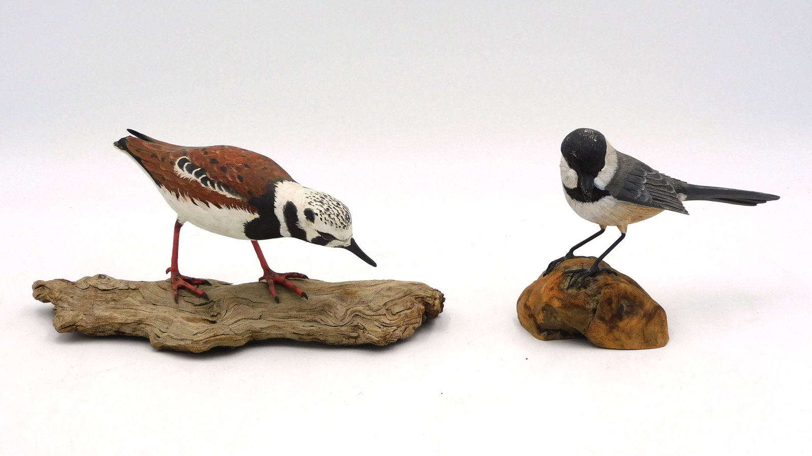 (2) Miniature Carved Wooden Shore Birds: To include: A) Signed "Lewis and Holland" on side and bottom. Ruddy Turnstone mounted on a driftwood base. 3 1/2" high x 7" wide x 3" deep. Good condition. B) Signed "R.P. Coburn" on bottom. Black Cap