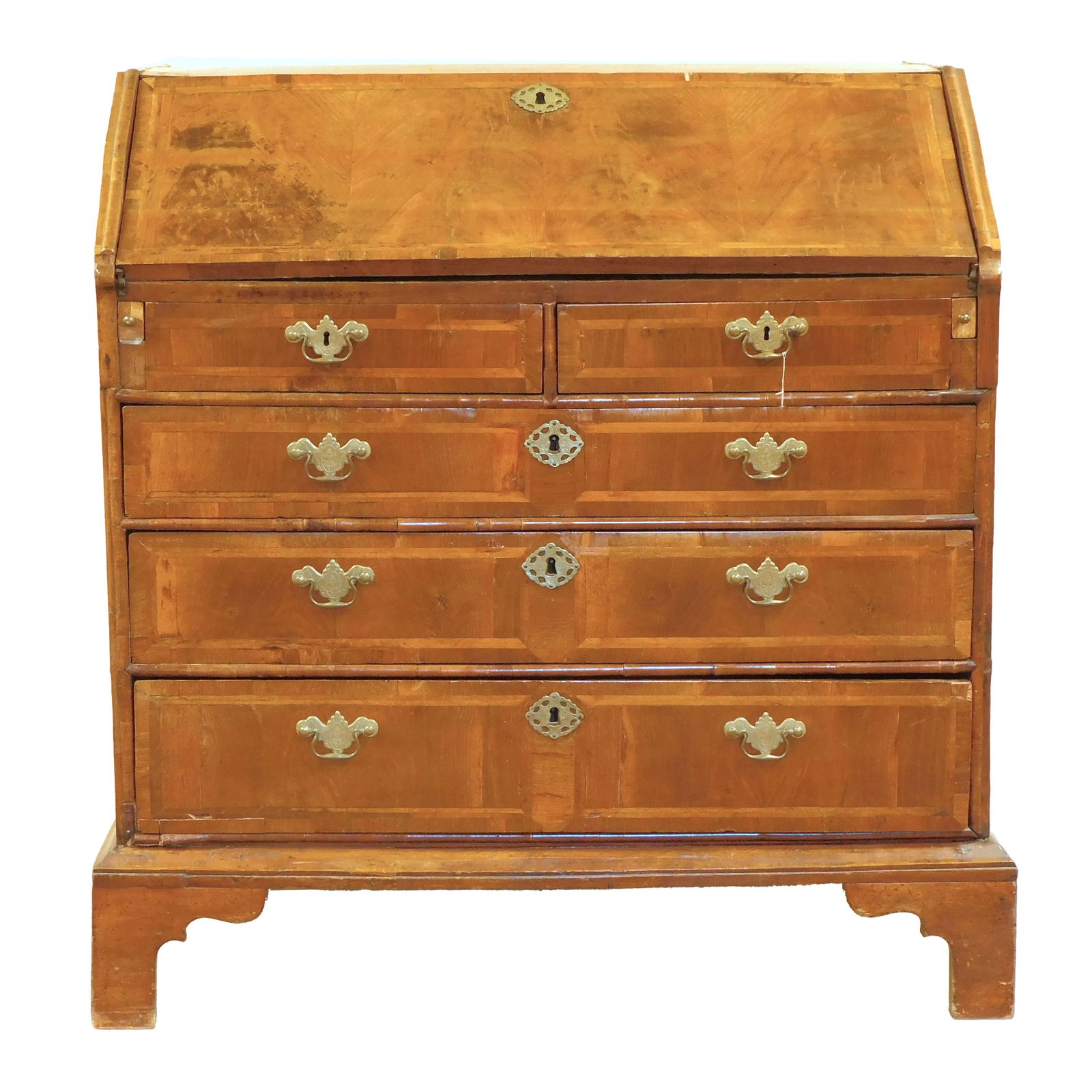 Continental Slant Lid Desk: 18th century. Burled walnut with banded inlay. Lid opens to reveal a multi-drawer interior. Two drawers over three graduated drawers supported by bracket feet. Ornate brass hardware. 42 1/2" high x 39