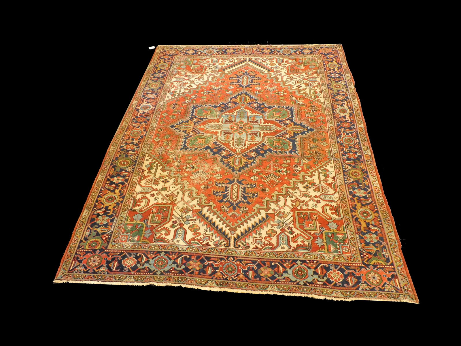 Persian Heriz Rug: Early to Mid-20th century. Semi-antique. Shows some areas of wear and some loss to ends. 8' 4" x 11' 6". Provenance: From the estate of Alan Gaines of A & A Gaines Antiques, Newport, Rhode Island.