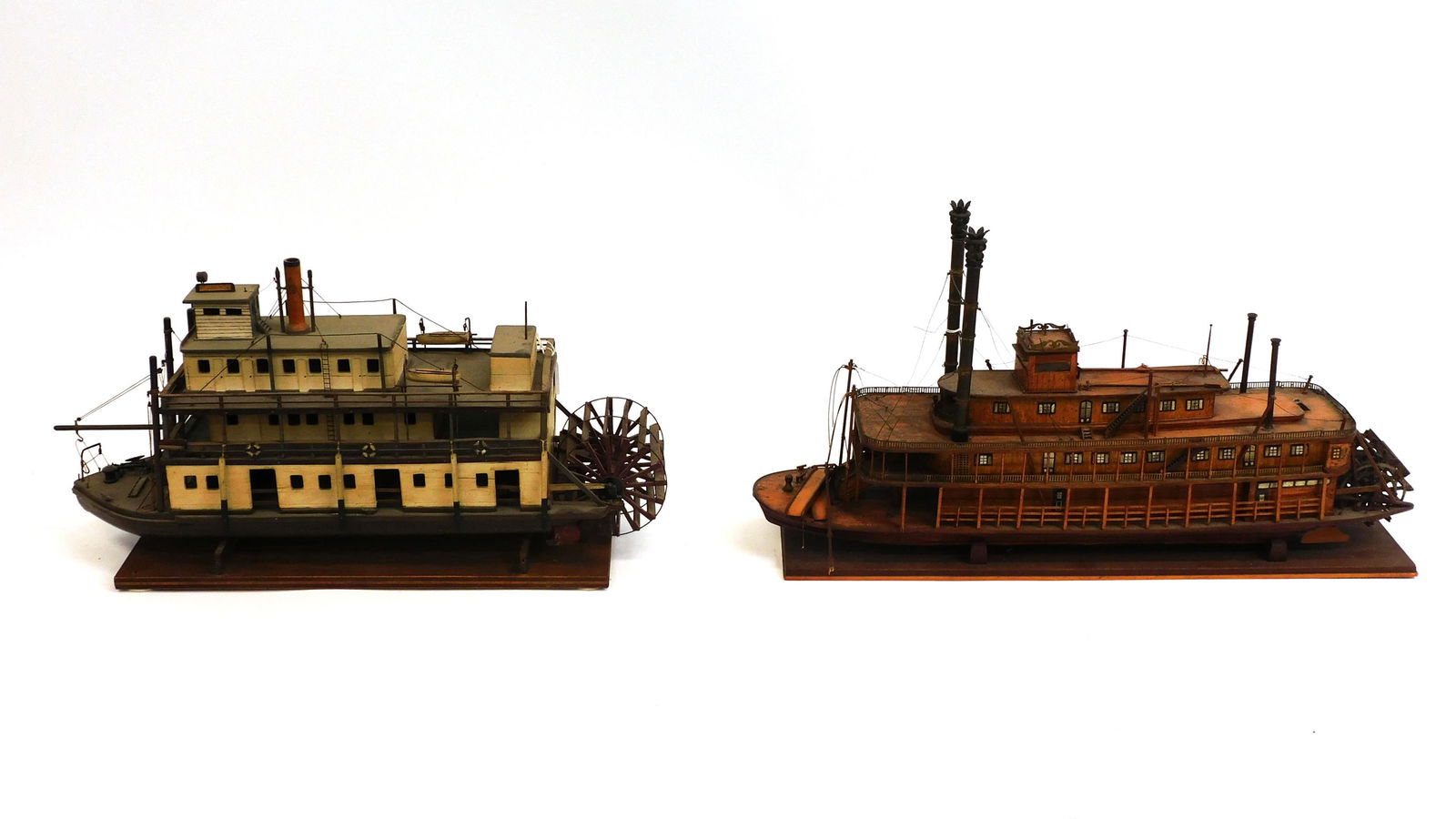 (2) Paddlewheel Steamship Models: Late 19th-Early 20th century. A) "White Horse." On a fitted wooden stand. Very well detailed, original paint. Working wooden paddle wheel. Two wooden lifeboats. With anchor. 12" high x 24" wide x 6" d