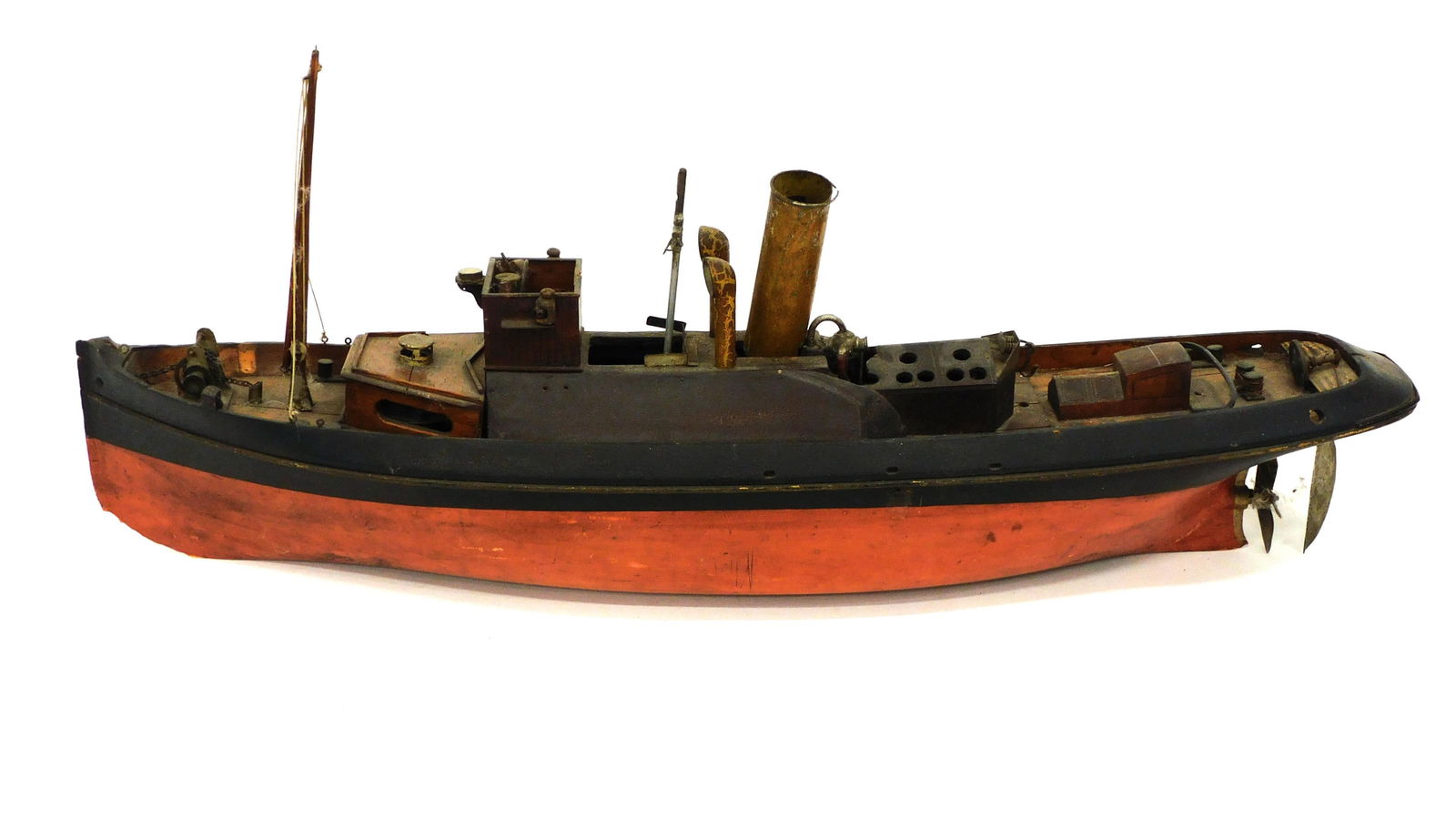 Wooden Steamboat Model: Late 19th century. Model steam engine. Metal propeller and rudder. 14" high x 33" wide x 7" deep. Fair condition, shows minor damage. Steam stack needs to be reattached. Provenance: From the estate o