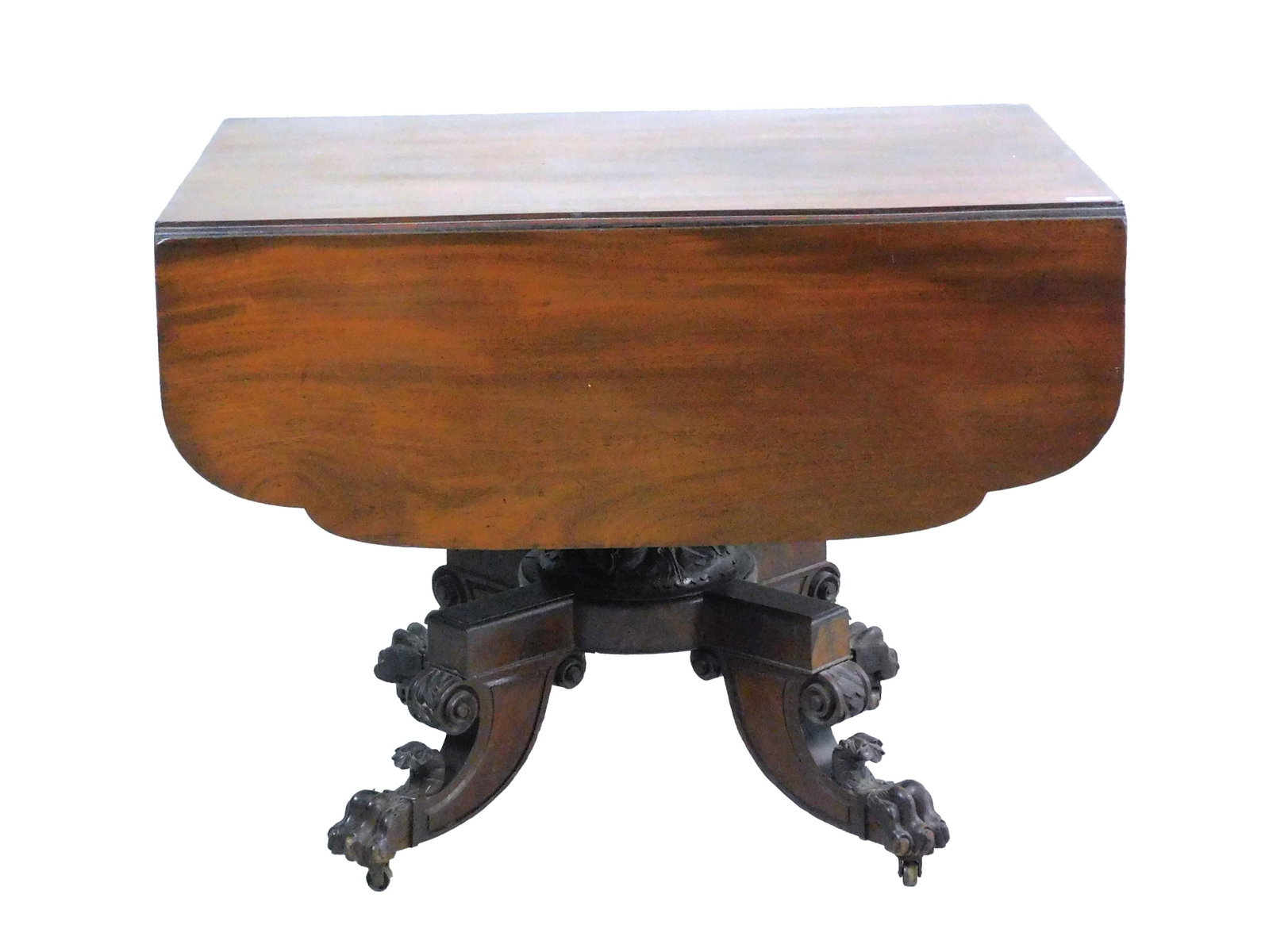 Federal Drop Mahogany Table: 19th century. The table has shaped drop leaves, carved shaft, acanthus and animal carved feet. 29" high x 37 1/2" wide x 24" deep x 13" drop leaf. Old finish, with age appropriate wear. Provenance: Fr
