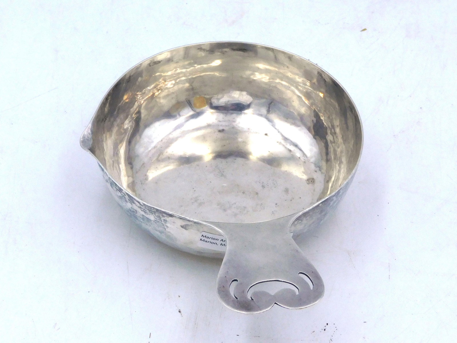 Silver Porringer: 18th/19th century. Colonial America. Hand hammered handle and bowl. Made from a single piece of silver with an unusual pouring spout. Engraved inscription dated 1801. 1 3/4" high x 7 1/2" wide x 5 3/8