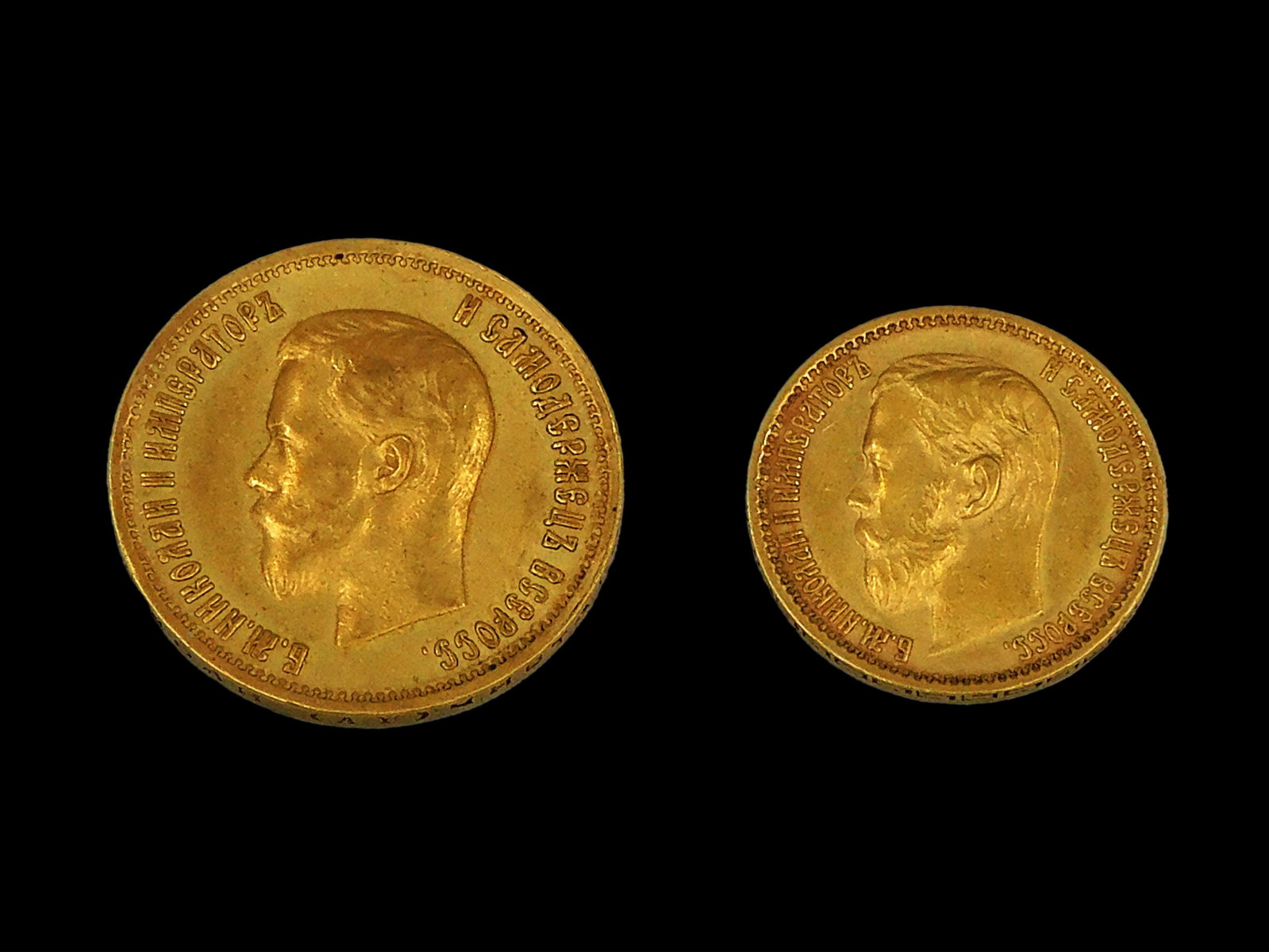(2) Russian Gold Coins: A) 1899 10 Rubles, 8.5 gms. B) 1899 5 Rubles, 4.2 g. Both with Czar Nicholas. Both in excellent condition. Shipping Restriction: Please note this lot must be paid for by cash, wire transfer or known c