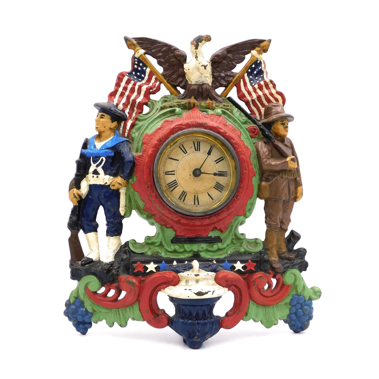 Spanish American War Themed Clock: 19th century. Hand-painted cast iron novelty clock. Figural design with eagle and two crossed American flags, a US Army soldier and a US sailor in 1898 uniforms with rifles in hand. Clock is a 30-hour