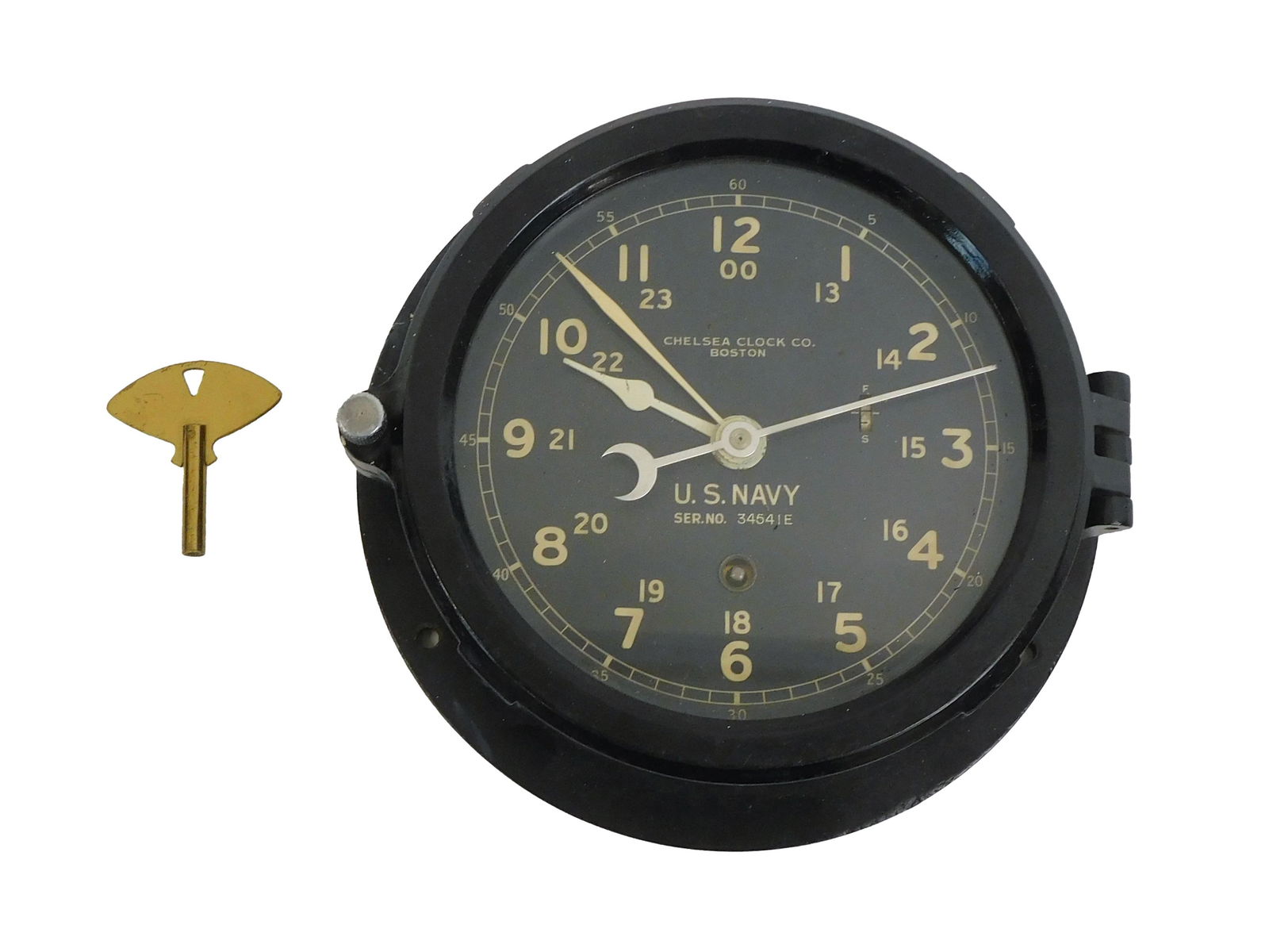 Chelsea US Navy Clock: 20th century. Bakelite case, Chelsea movement and key. US Navy marked "3454IE". 7 1/2" diameter. Currently working.