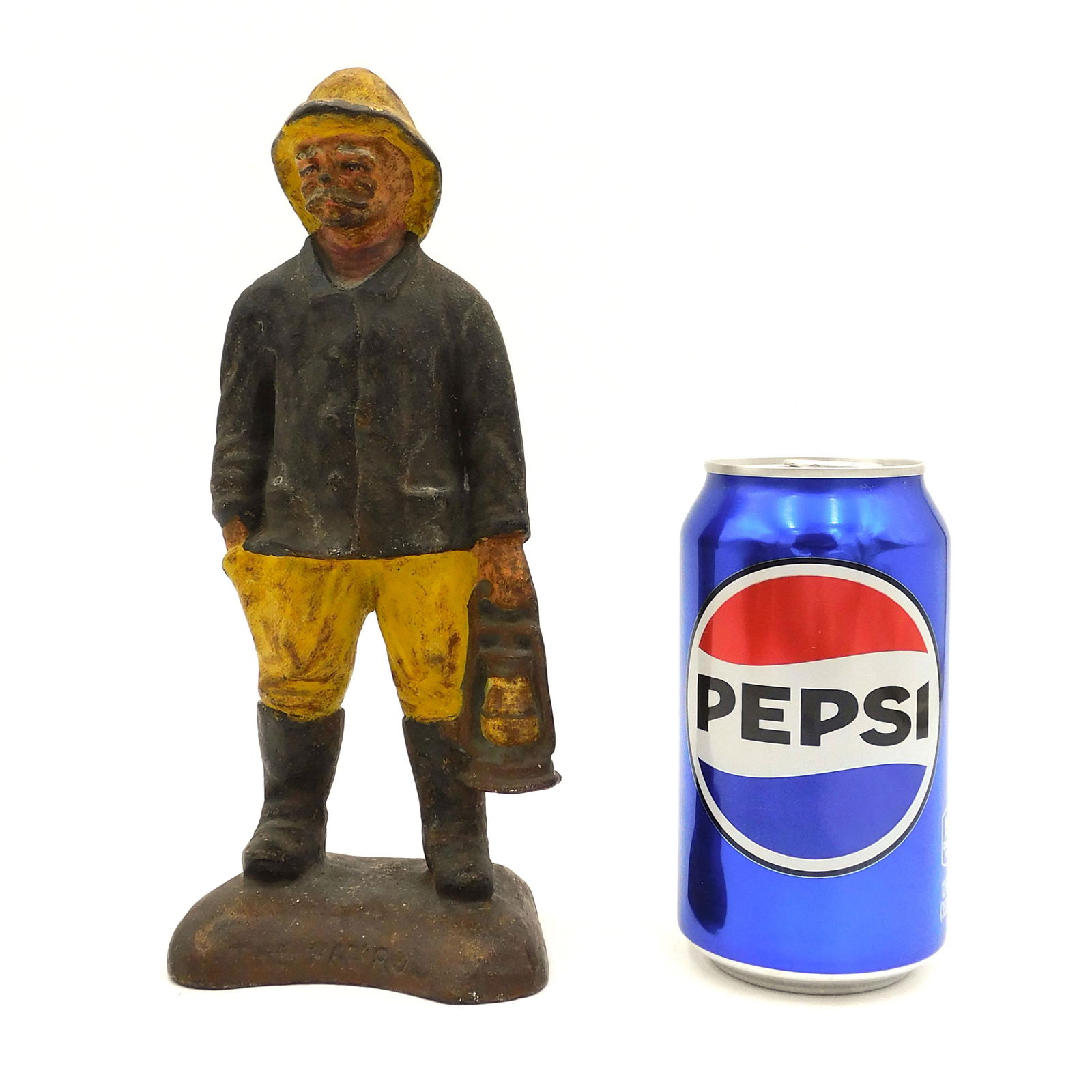 Cast Iron Doorstop "The Patrol": Depicting a fisherman with a lantern. Original paint. Rare form. 9" high x 3 1/2" wide x 2 1/2" base.