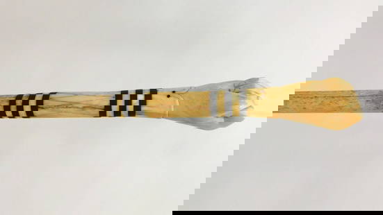Scrimshaw Walking Stick: Carved clenched fist pommel, baleen, whalebone shaft and brass tip. 34 3/4" long. Shipping restriction: Please note this lot is not available to be sold or shipped internationally. It is the responsib