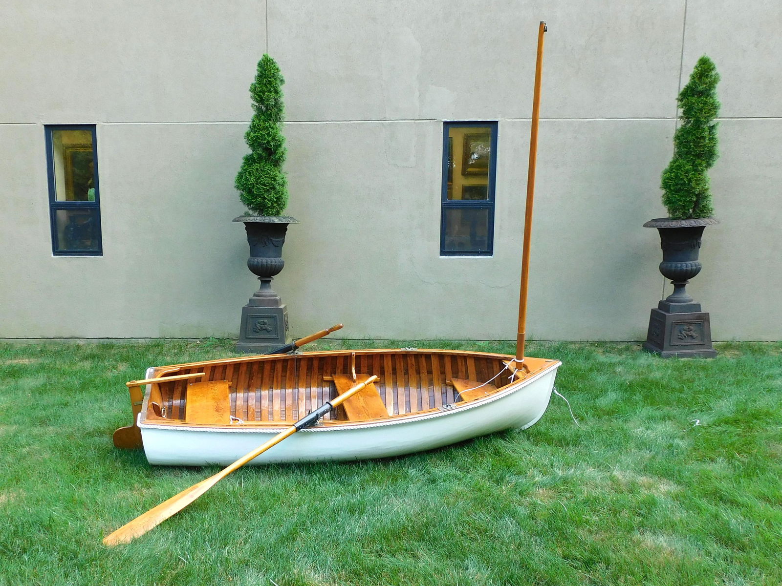Old Town Yacht Tender: Ca. 1920. Three seats, oars, paddle, masts and sails. Brass fittings, rope trim, painted canvas exterior lapstrake construction. 2' high x 47" wide x 9' 2 1/2" long.