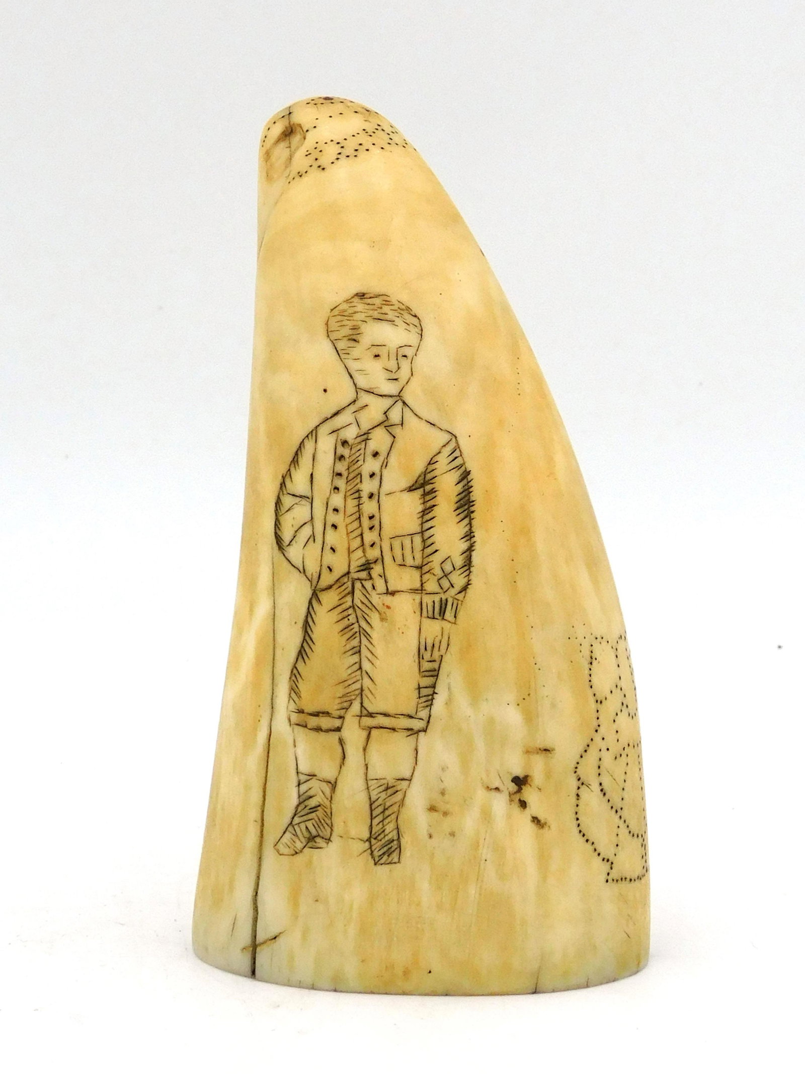 Scrimshaw Whale's Tooth: 19th C. By Rev. J.W. Dadum, Civil War chaplain. Depicts standing young man, possible biblical scene with figures and carved bird head at tip. 4 1/4" high x 2 3/8" wide. Shipping restriction: Please no