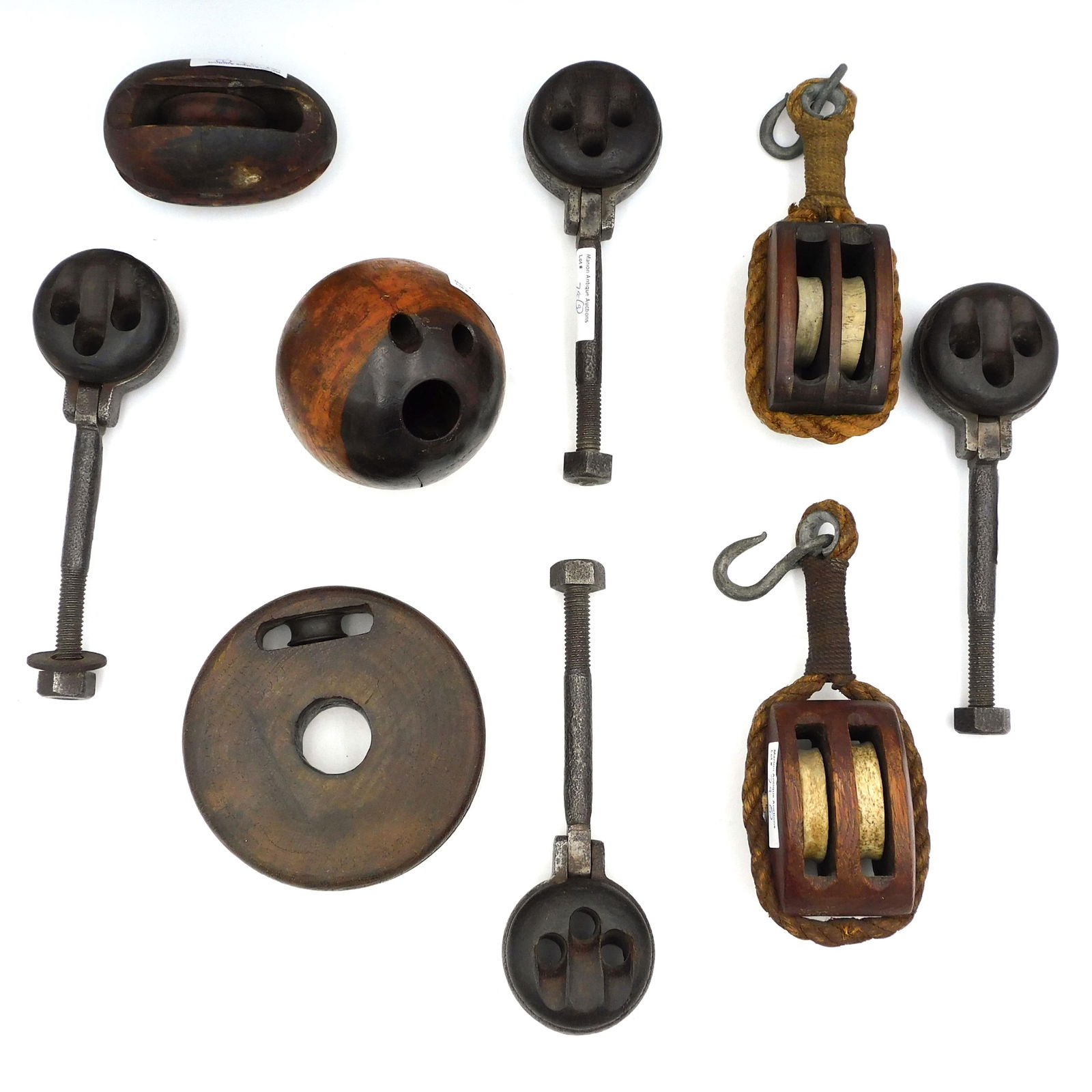 (9) Deadeyes and Blocks: To include: (A) Four matching swiveling deadeyes, lignum vitae and wrought iron. 8 1/4" high x 2 1/2" wide. (B) pair of double sheave blocks with whalebone sheaves and rope trim with hooks. 9 1/2" hig