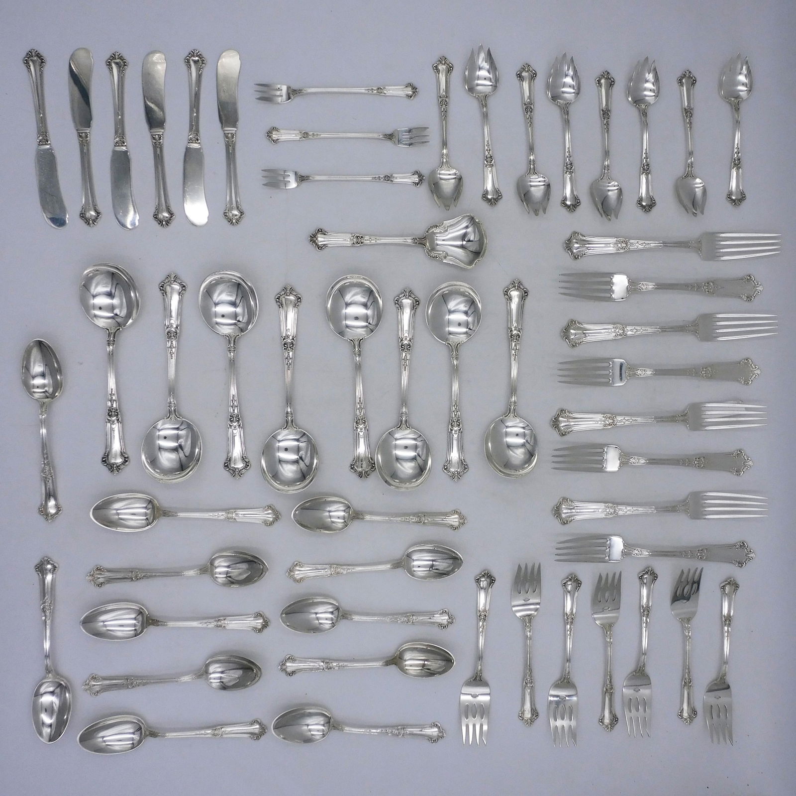 (52) Pieces Gorham Sterling Flatware: Ca. 1912 Albemarle pattern. To include: (A) Eight dinner forks. 7 5/8" long. (B) Six butter knives. 5 3/4" long. (C) Eight soup spoons. 6 3/4" long. (D) Twelve teaspoons. 6" long. (E) Eight ice cream