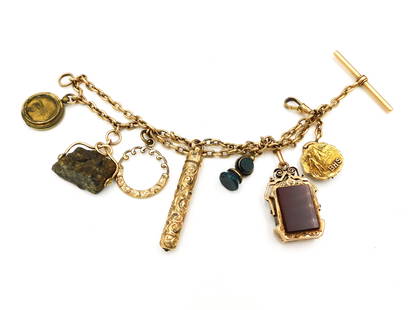 Antique Gold Charm Bracelet: Gold and gold-filled with the following charms: (A) 14kt marked "BHS 1907". (B) Gold filled dog clip style clasp. (C) 14kt gold tested fob with carnelian and onyx panels, within which are photographs