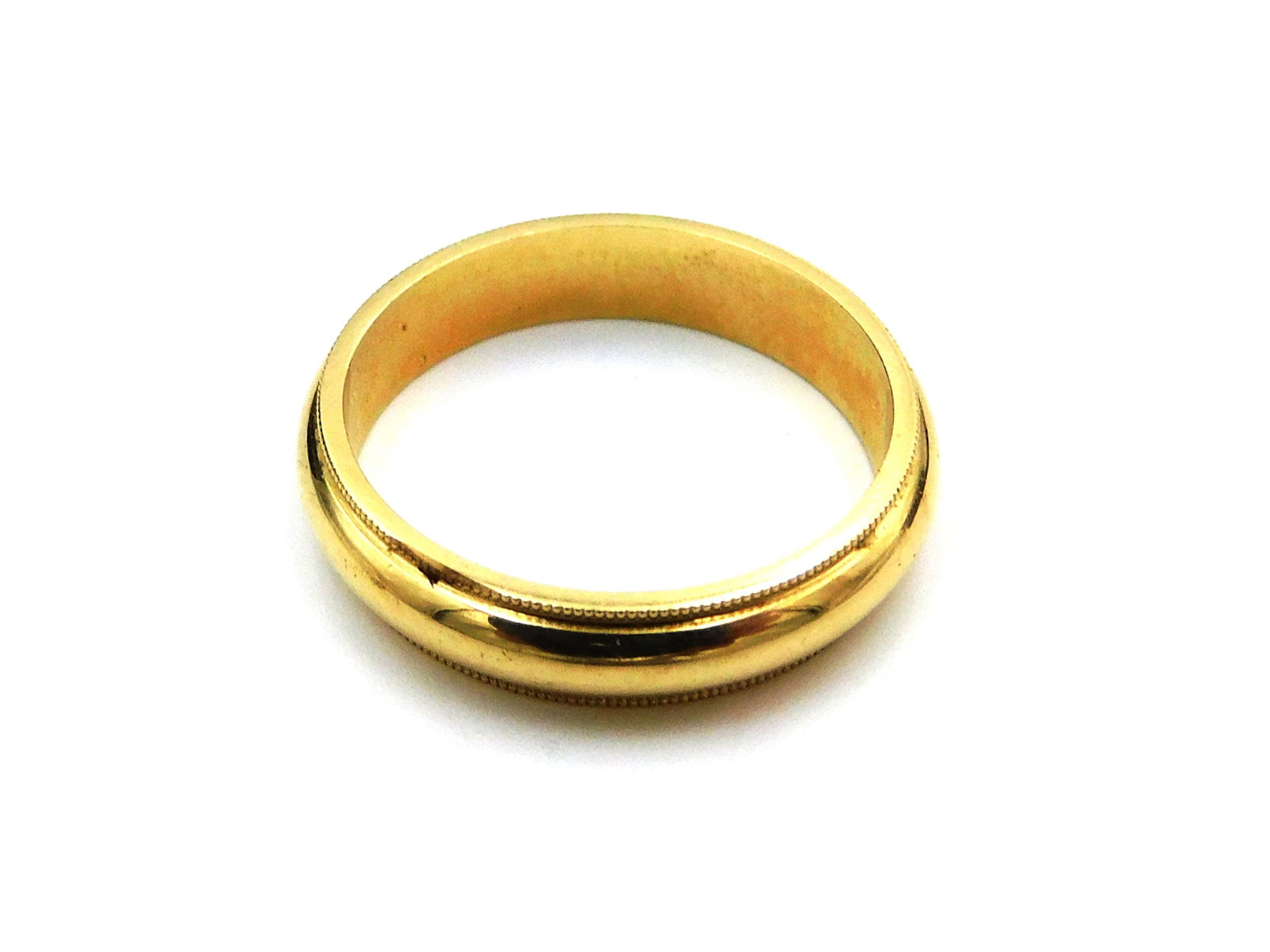 Man's Gold Wedding Band: Size 10. 14 kt. 3.83 dwt. Please note this lot must be paid for by cash, wire transfer or known check. Items will be shipped or sent to shipper once payment clears.