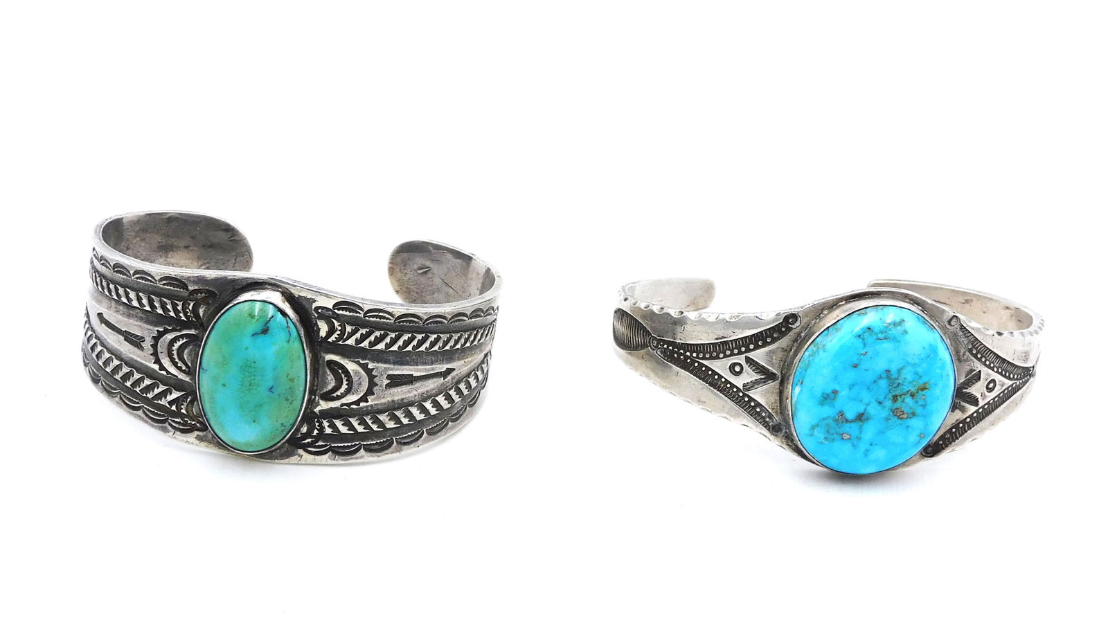 (2) Navajo Silver Bracelets: 20th C. With Large turquoise nuggets. Engraved designs. 1 1/2" high x 2 5/8-2/7/8" wide. Please note this lot must be paid for by cash, wire transfer or known check. Items will be shipped or sent to s