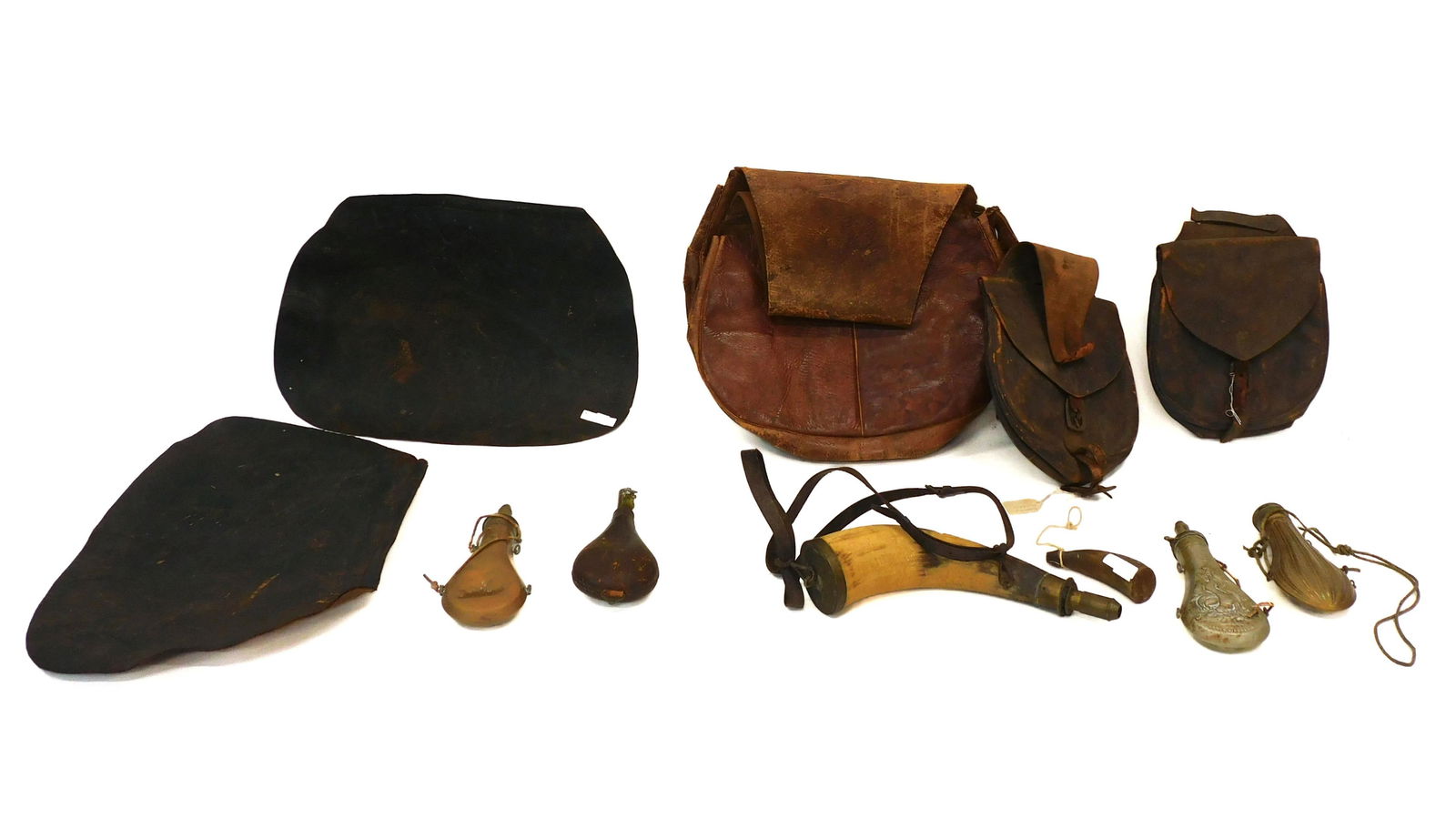 (9) Piece William Savery Homestead Lot: 19th C. To include: (A) Powder flask. By James Dixon with embossed gamebirds and rabbit. 8 1/2" long. (B) Copper flask with embossed hunting scene. 8 1/4" long. (C) Leather flask. 9" long. (D) Brass f