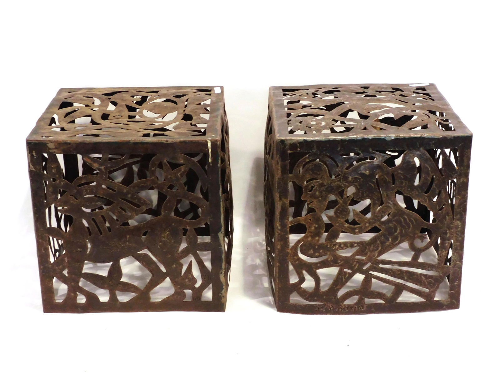 Jean Pierre Bernard For Harvey Probber: Ca. 1960s - 70s. Two torch-cut welded and chased steel cubes, made in Croix -des-Bouquets, Haiti of recycled steel drums. Typical of Haitian folk art, the panels feature birds, foliage, humanoid figur