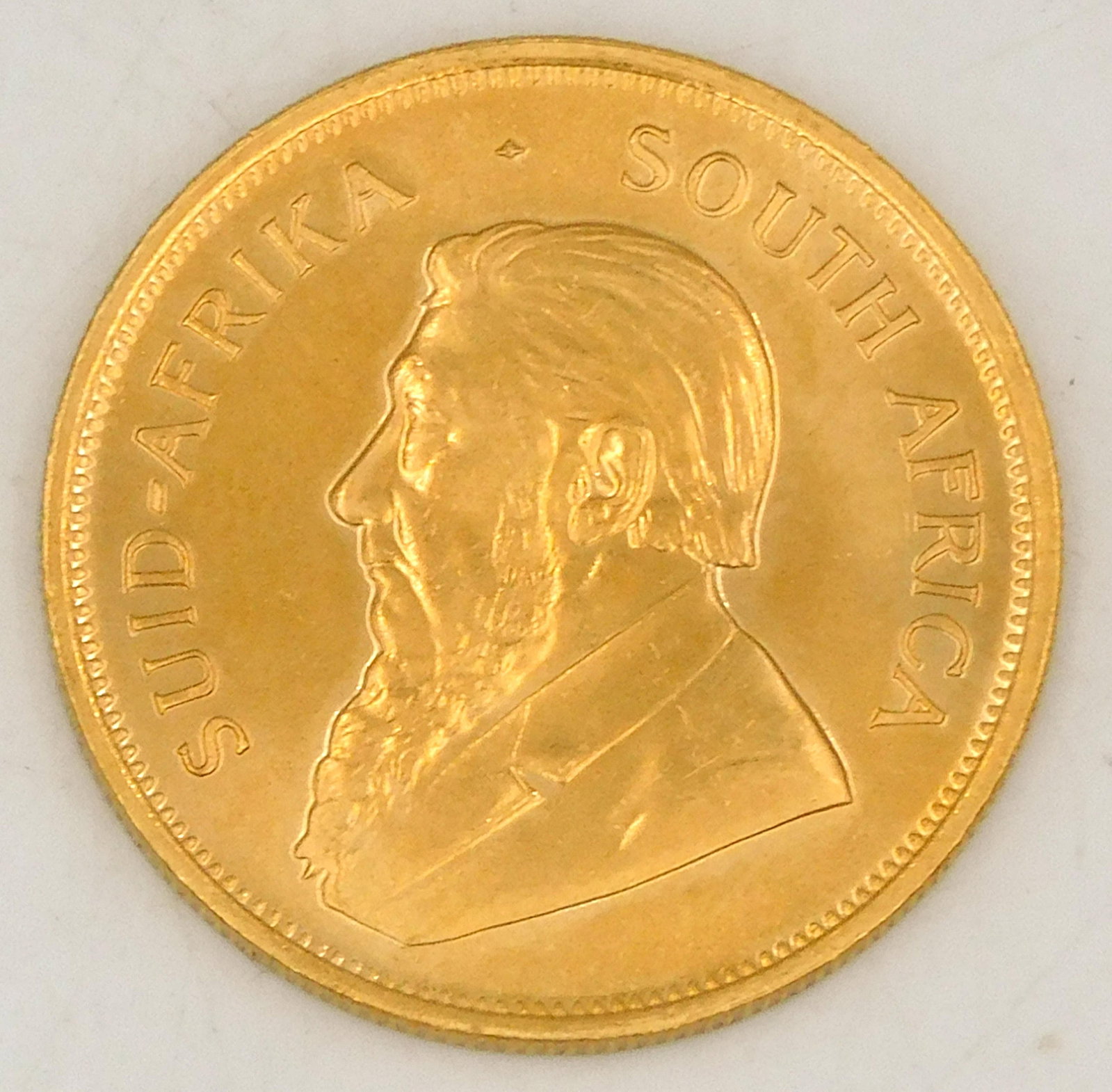 1980 Krugerrand Gold Coin: 1 ounce fine gold. Please note this lot will not be available for in-person viewing. Please note this lot must be paid for by cash, wire transfer or known check. Items will be shipped or sent to shipp