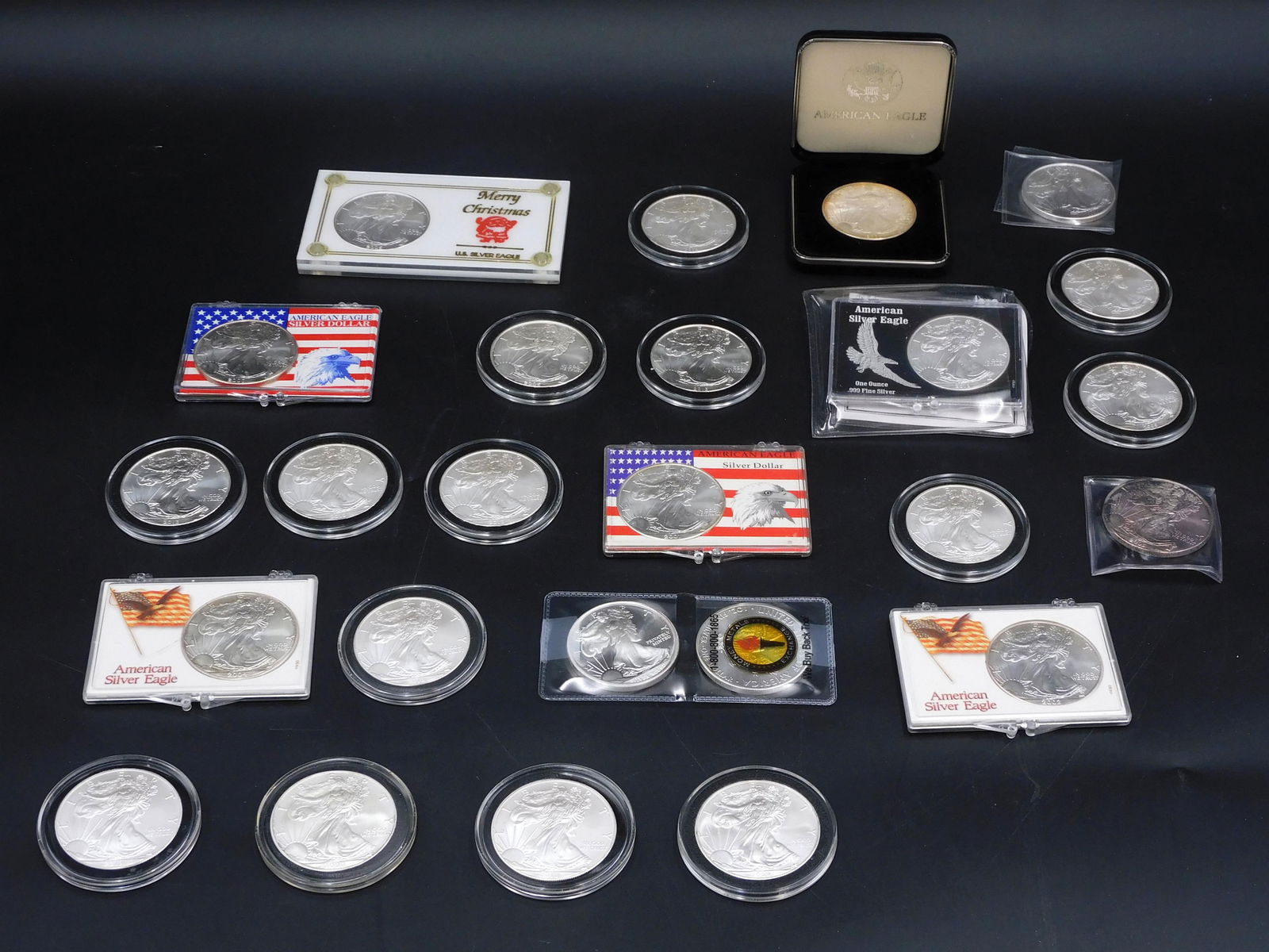 (25) Silver Eagle Rounds: To include: (3) 2000; (1) 2001; (1) 2002; (1) 2003; (1) 2004; (2) 2005; (2) 2009; (8) 2012; (3) 2013; (2) 2015; (1) 2021. One ozt. .999 each. Please note this lot must be paid for by cash, wire transf
