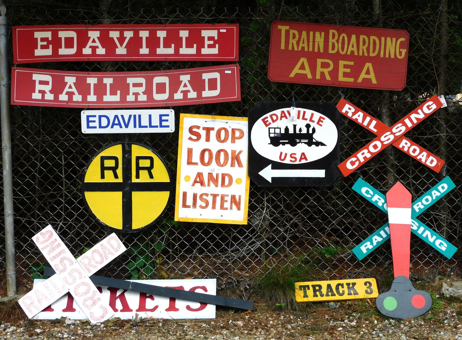 (13) Edaville Railroad Vintage Signs: To include: Railroad Crossing; Ticket and Track signs. Wood and metal. Ranging in size from 5 3/4" to 21" high x 22" to 60" wide. Provenance: From the Edaville Railroad Cranberry Museum.