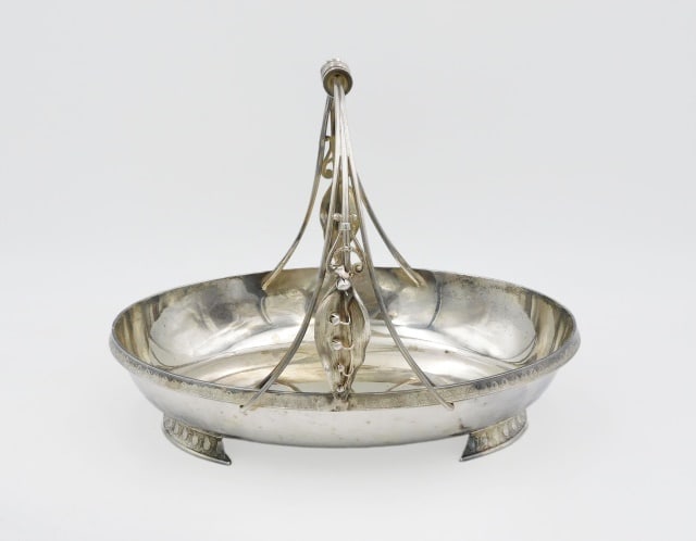 Sterling Silver Handled Bowl: Late 19th C. Gorham. Leaf and blossom design. 8 1/2" high x 9 3/4" wide x 7" deep. 19.45 ozt. Please note this lot must be paid for by cash, wire transfer or known check. Items will be shipped or sent