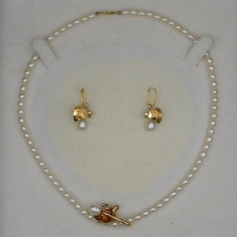 (3) Piece Necklace and Earring Set: 20th C. Tested 14 kt. To include: (A) Pearl necklace with leaf form pendant set with pearl and diamond. 18" long. (B) Matching pierced earrings with pearl and diamond. 1 1/4" long. 6.3 total dwt penda