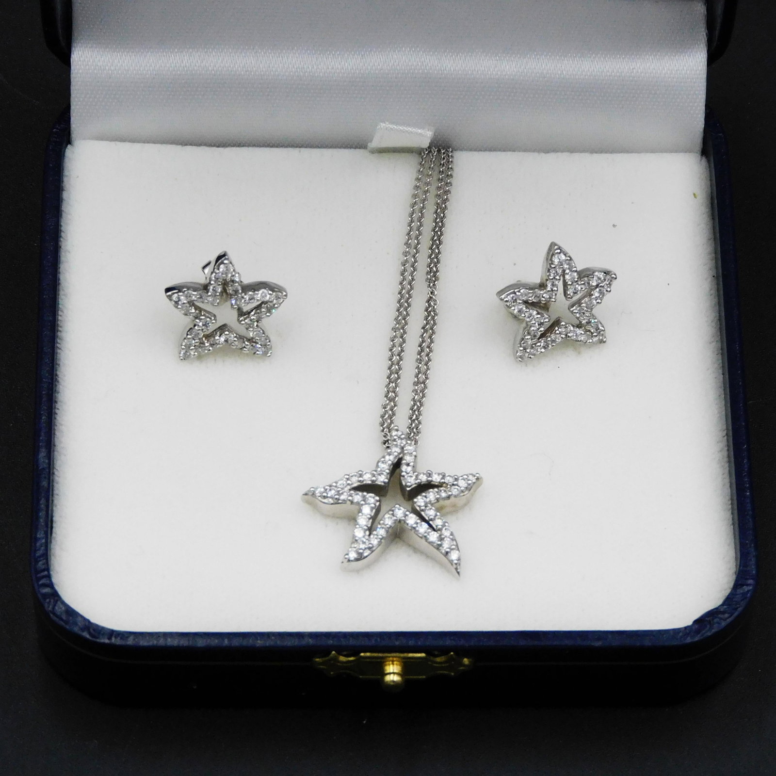 Starfish Design Necklace and Matching Earrings: 20th C. 14kt white gold. Necklace is double chain with diamonds. 16 1/2" long. Pierced earrings. 8.3 total dwt. Please note this lot must be paid for by cash, wire transfer or known check. Items will 