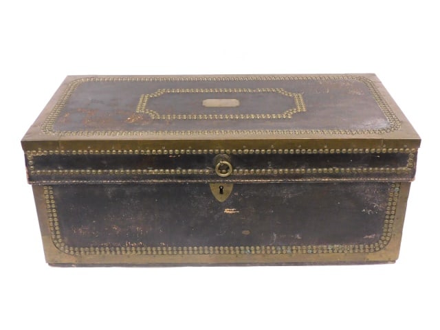 Chinese Export Camphorwood Box: Early 19th C. Lift top. Painted leather wrapped with brass trim and handles. Brass tack trim. 10" high x 25" wide x 12 1/2" deep.