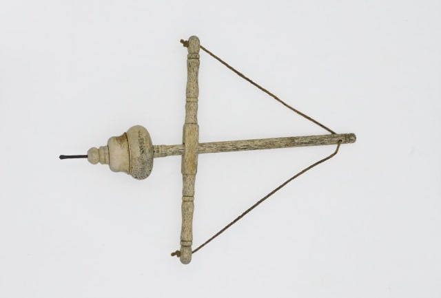 Scrimshaw Pump Drill: 19th C. Rare whalebone hand drill with iron tip. Probably used by a carpenter. 10 1/4" high x 7 1/2" wide.
