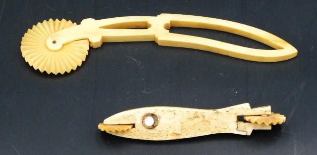 (2) Scrimshaw Pie Crimpers: 19th C. Sailor made. To include: (A) 7 1/2" long. (B) Fish form pie crimper or jagging wheel with inlaid baleen and abalone eyes. Two wheels. 5" long.