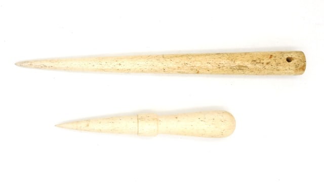 Scrimshaw (2) Panbone Fids: 19th C. 16" long and 10" long. 16" fid has faint scrimshaw design. 10" fid has belaying pin-form handle and a nicely carved collar. Provenance: Property deaccessioned from the Old Dartmouth Historical
