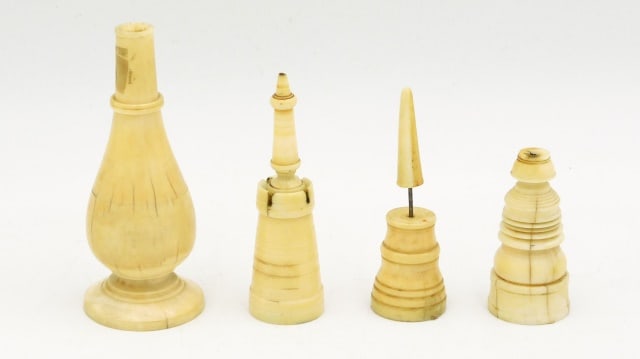 (4) Scrimshaw Pickwicks: 19th C. To include: (A) Vase shaped with footed base. 4 1/4" high x 1 3/4" diameter at base. (B) Fancy grooved decoration. Bottom cavity is filled with red ceiling wax. 2 1/2" high x 1" diameter at ba