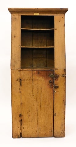 Slant-Back Open Cupboard: Early 19th C. Probably New Bedford, Massachusetts area. Pine. Old faded mustard color paint. Shaped shelves. Old label reads: Gift from F. Gilbert Hinsdale. 74 1/2" high x 30 1/2" wide x 16 1/2" deep.
