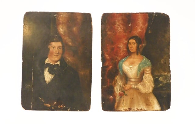 Pair of Primitive Portraits on Board: Early 19th C. Depicting a man and woman, possibly husband and wife. Man is wearing a black topcoat with white ascot holding several quill pens. Woman is in a gown with blue shawl and is holding a rose