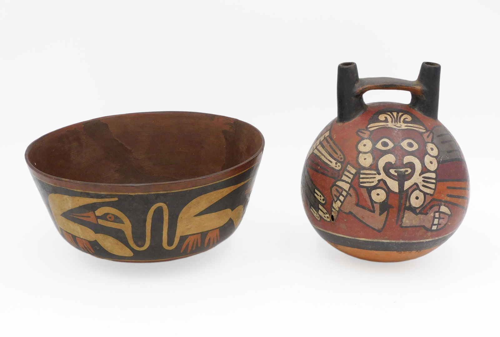 (2) Nazca Pottery Vessels: Pre-Columbian. To include: (A) Bowl. 3 3/4" high x 7 3/4" diameter. (B) Water jug. Polychrome decorated with figures. 6 3/4" high 5 1/4" diameter.