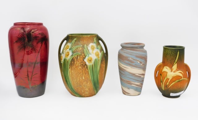 (4) Pieces of Art Pottery: Early 20th C. To include: (A) Roseville handled vase in the jonquil pattern. 8" high. Original paper label on bottom. (B) Roseville handled vase in lily pattern. 6 1/2" high. Raised signature on verso