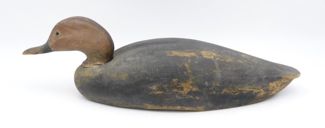 Early Wooden Duck Decoy: Possibly Keyes Chadwick (1865-1958), Martha's Vineyard, Massachusetts. Black duck decoy. Glass eyes. 5" high x 18" wide x 6" deep.