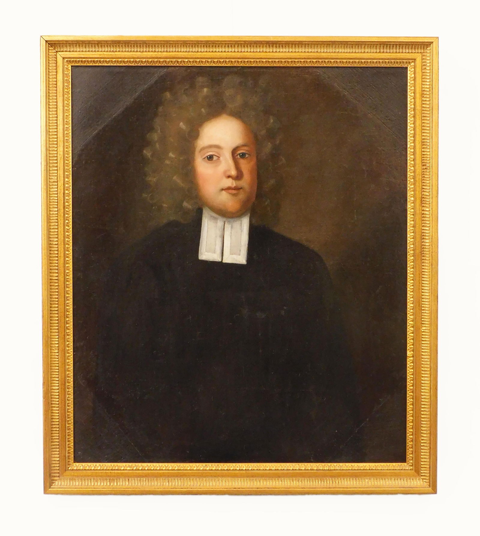 Portrait of a Minister: 18th/19th C. Oil painting on canvas. Minister has a white collar. Unsigned. Sight size 28" high x 23 1/2" wide. In a modern gold frame measuring: 32 1/4" high x 28" wide. Provenance: From the estate o