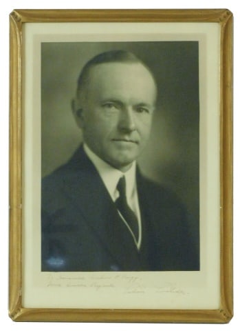 President Calvin Coolidge Signed Photograph: President of the United States 1923-1929. Dedicated to the Honorable Arthur P. Rugg. Photograph by Harris and Ewing, Washington, D.C. In a carved gold frame measuring: 18" wide x 13" high.