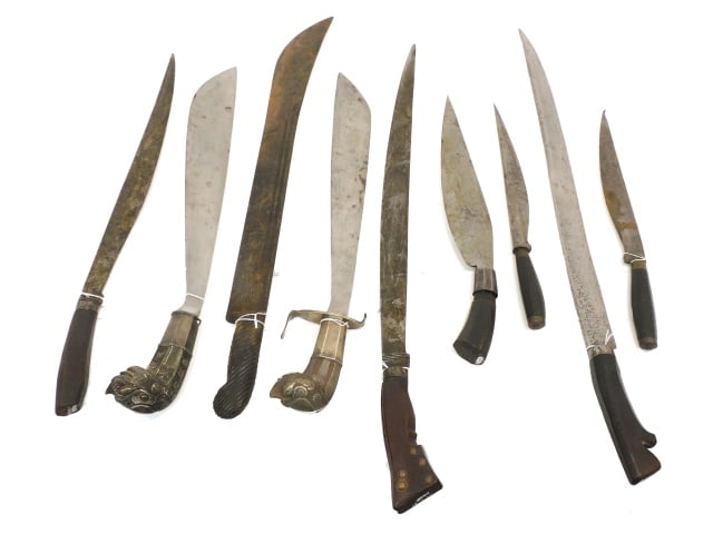 (9) Edged Weapons: 19th/early 20th C. Two are Bolo knives. Two are Golok machetes with figural dragon handles, heavy forged steel. One is a machete with a horn handle. Along with five various edge weapons with wood hand