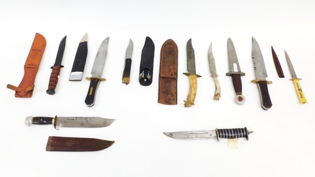 (10) Miscellaneous Commando and Hunting Knives: To include: (A) USMC Ka-bar Commando knife and sheath. 19" long. (B) Commando. No sheath. 12" long. (C) Horn handled hunting knife and tooled leather sheath with scrimshawed wolf design. 14" long. (D)
